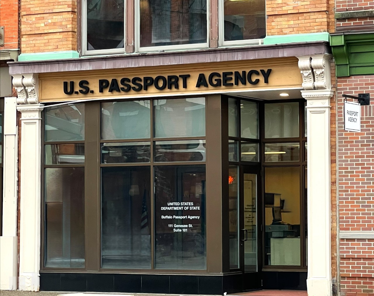 Front entrance of the Buffalo Passport Agency. “U.S. Passport Agency” is visible above glass doors and windows..