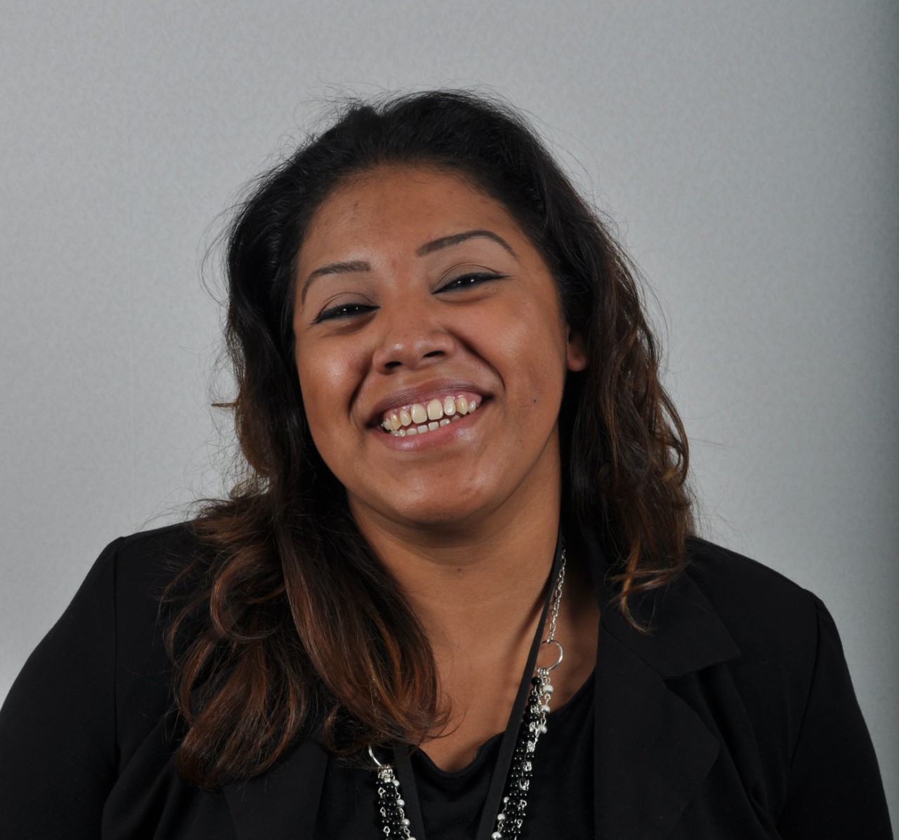 Photo of a woman at a slight angle with her eyes partly closed.