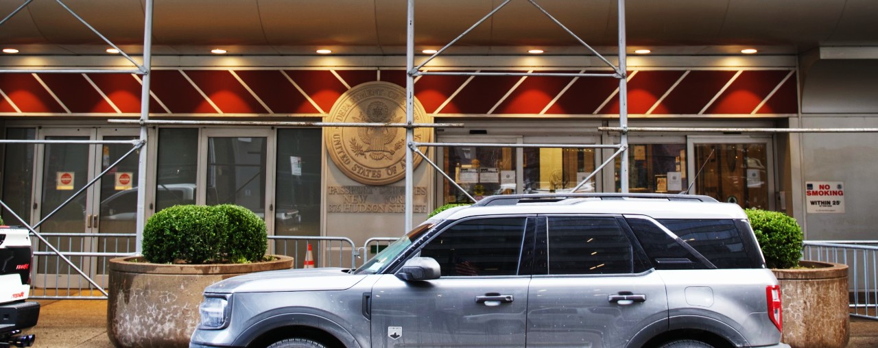 Exterior of New York Passport Agency. Its entrance is street-level with construction over the sidewalk.